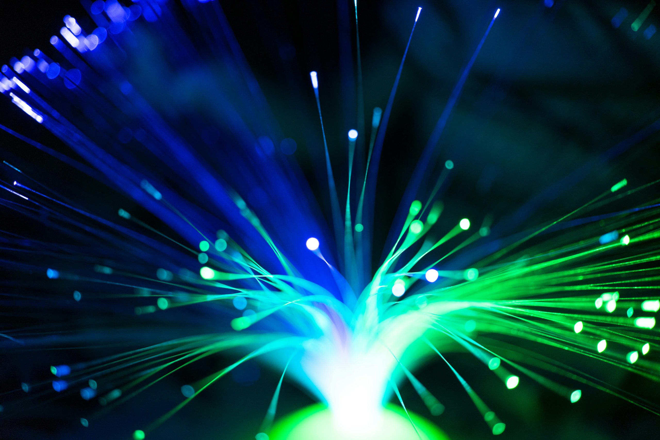 Close-up of green and blue fiber optic strands